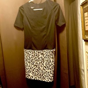 A dress that looks like a two piece outfit. Black top half  mini skirt like bum